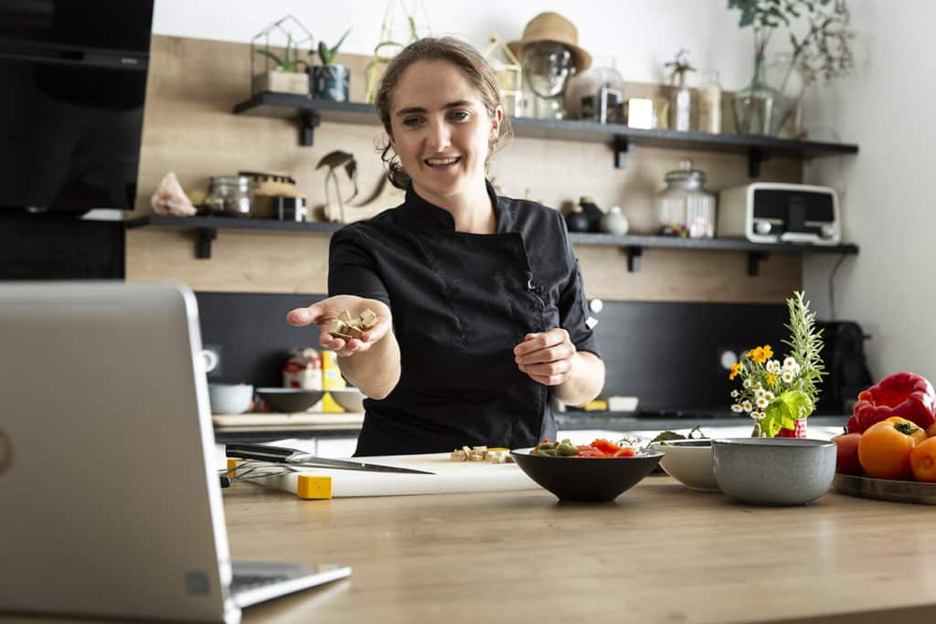 Chef giving a lesson of cooking by videoconference